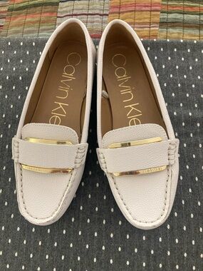 Calvin Klein Women's Ivory Moccasin Loafers with Gold Bar